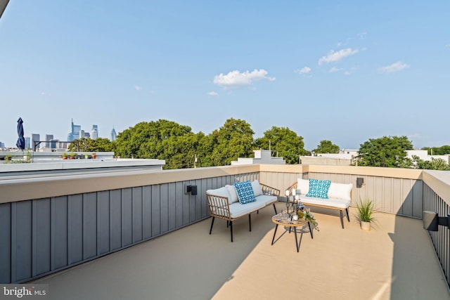 view of patio / terrace with a balcony and a city view