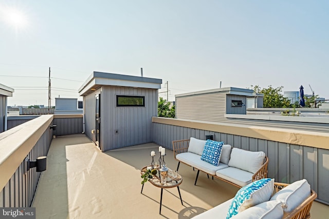 view of patio with a balcony and outdoor lounge area