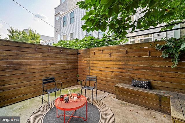 view of patio featuring fence