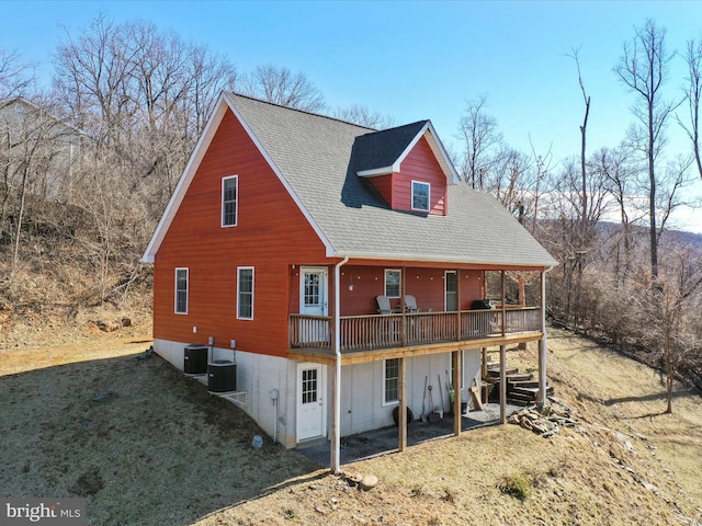 back of house with a deck, stairway, cooling unit, and a yard