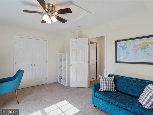 sitting room featuring carpet floors and ceiling fan