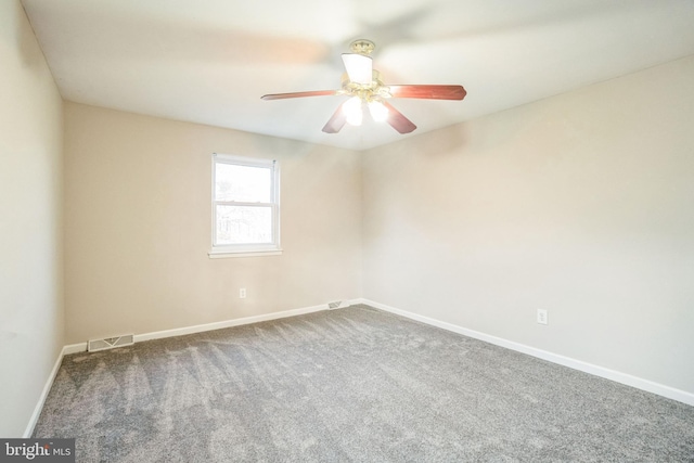 empty room with a ceiling fan, visible vents, baseboards, and carpet flooring