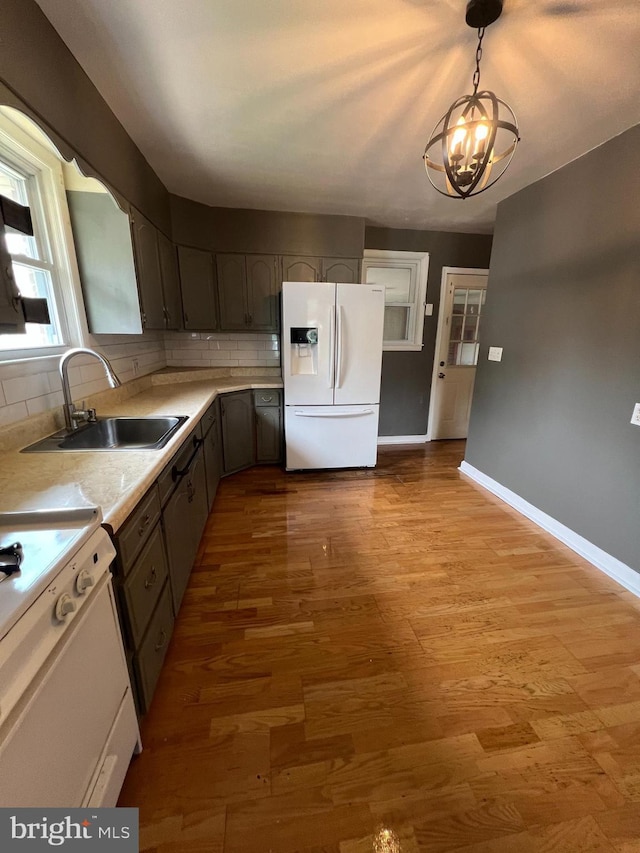 8211 Beach Dr, Baltimore, MD 21222 - kitchen featuring white refrigerator with ice dispenser, a sink, range, and decorative backsplash