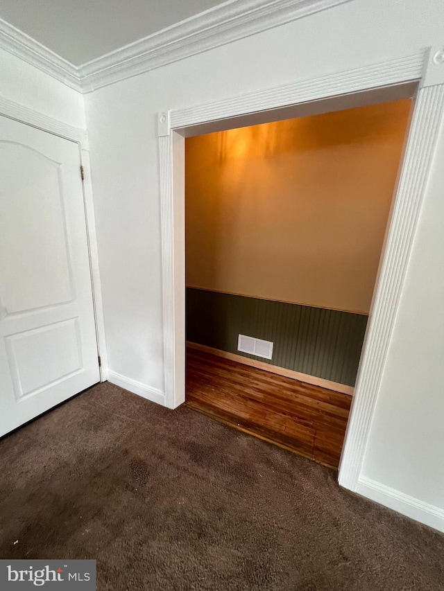 8211 Beach Dr, Baltimore, MD 21222 - empty room featuring dark colored carpet, crown molding, and baseboards