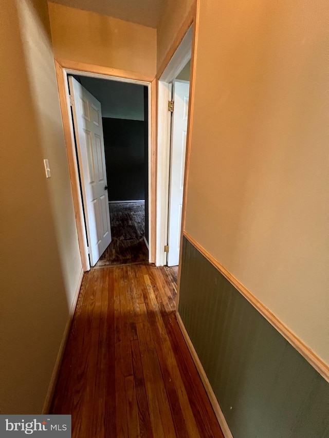 8211 Beach Dr, Baltimore, MD 21222 - corridor with dark wood-type flooring and baseboards