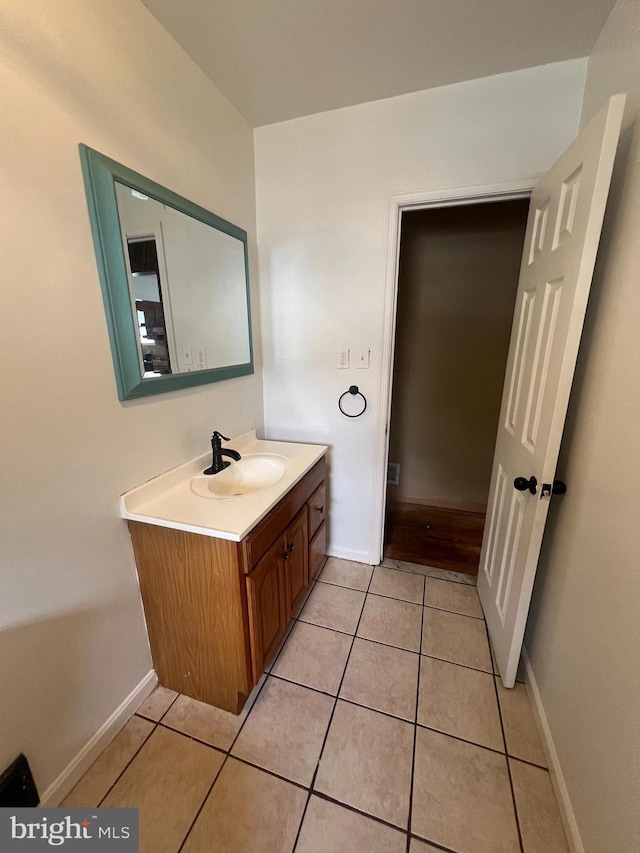 8211 Beach Dr, Baltimore, MD 21222 - bathroom featuring tile patterned floors, vanity, and baseboards