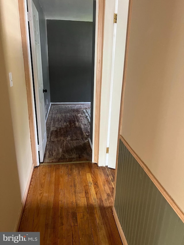8211 Beach Dr, Baltimore, MD 21222 - hallway featuring wainscoting and wood-type flooring