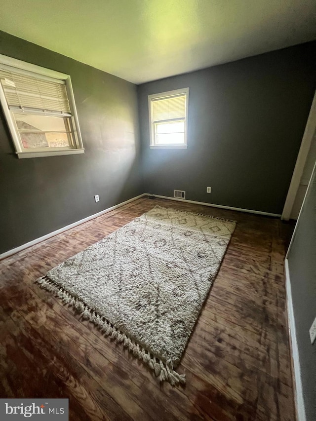 8211 Beach Dr, Baltimore, MD 21222 - unfurnished room featuring wood finished floors and baseboards