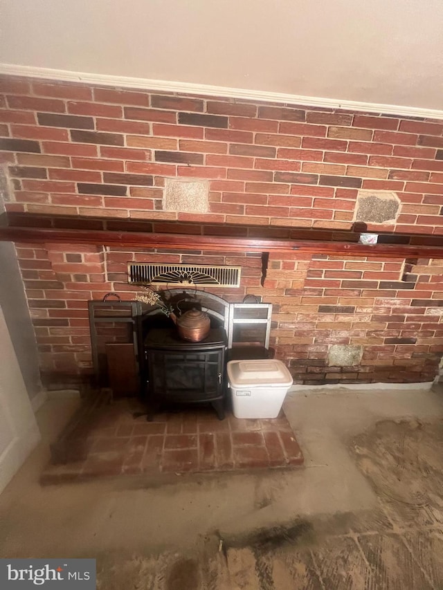 8211 Beach Dr, Baltimore, MD 21222 - detailed view of a wood stove and concrete floors
