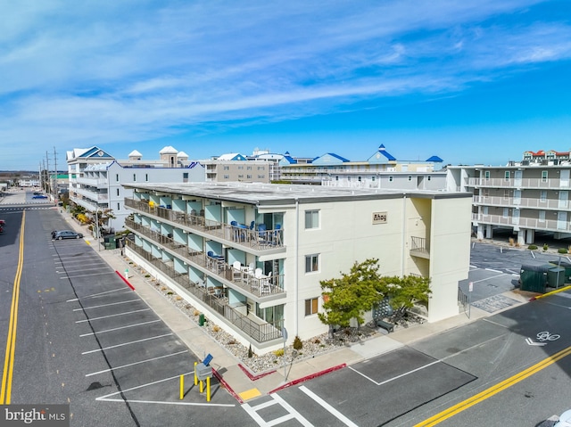 view of property featuring uncovered parking