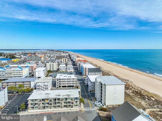 bird's eye view featuring a beach view and a water view