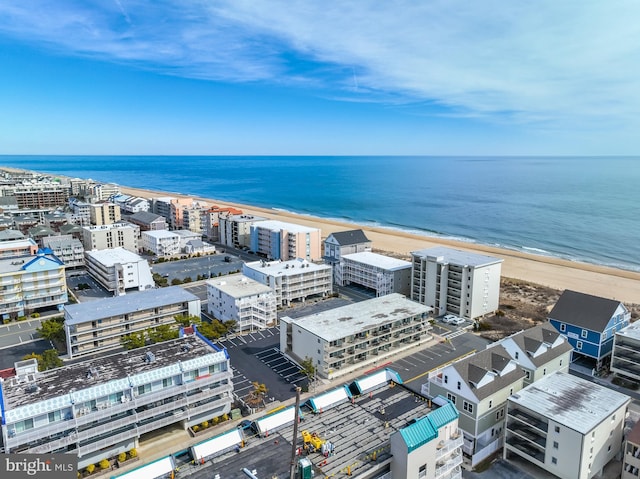 aerial view featuring a view of the beach and a water view