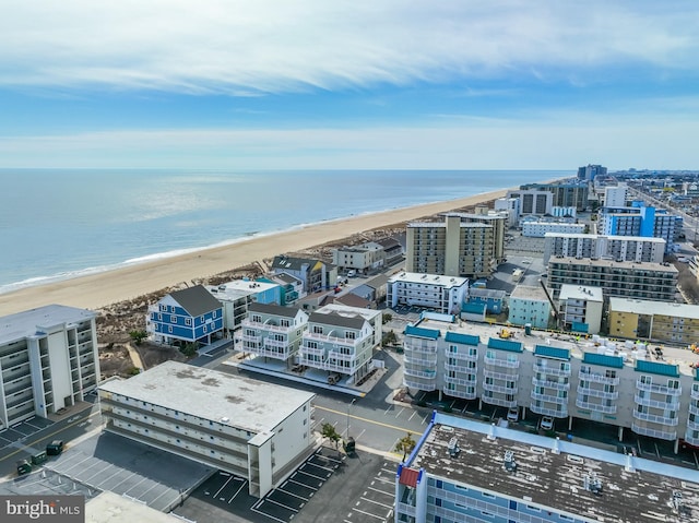 bird's eye view with a view of the beach and a water view