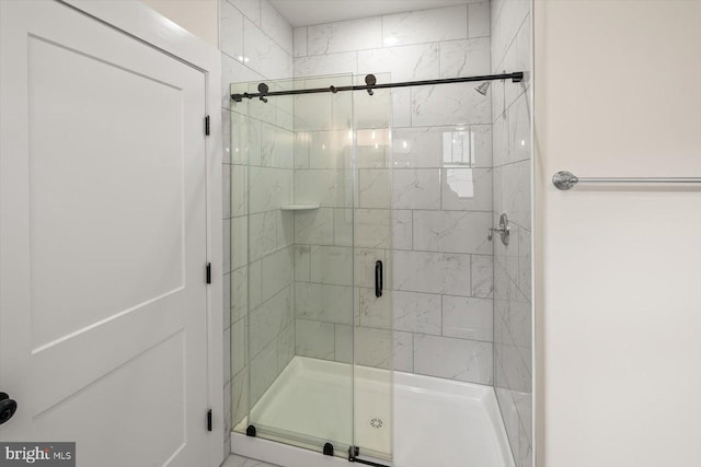 bathroom with a shower stall