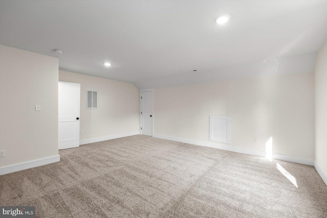 carpeted empty room with recessed lighting, visible vents, and baseboards