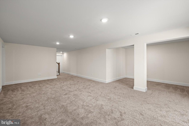 finished basement with recessed lighting, carpet flooring, visible vents, baseboards, and stairs