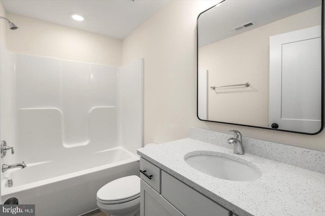 bathroom featuring toilet, visible vents, shower / bathing tub combination, and vanity