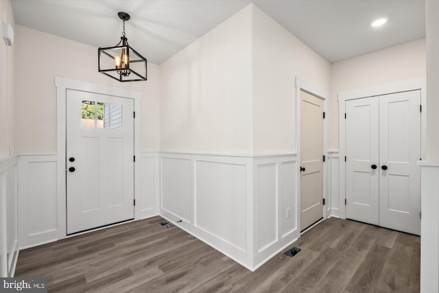 entryway featuring wainscoting and wood finished floors