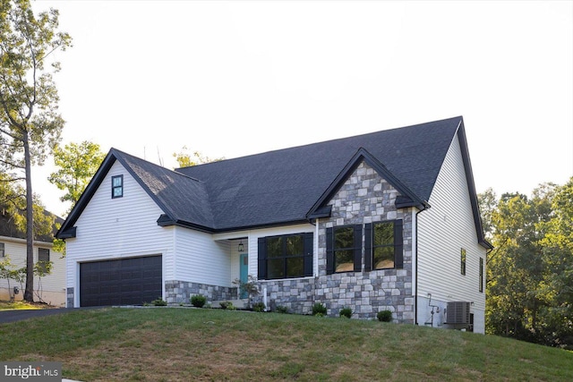 view of front of house featuring driveway, stone siding, and a front yard