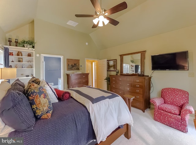 bedroom with ensuite bath, vaulted ceiling, light colored carpet, and ceiling fan