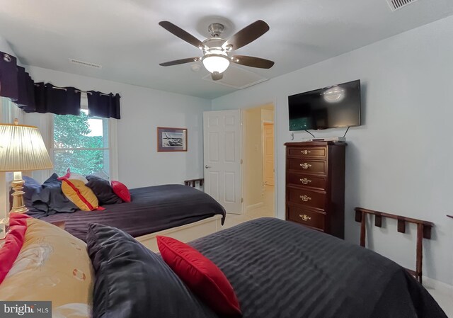 bedroom with baseboards, visible vents, carpet floors, and ceiling fan