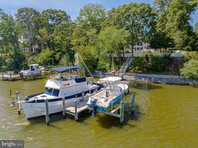 dock area with a water view and boat lift