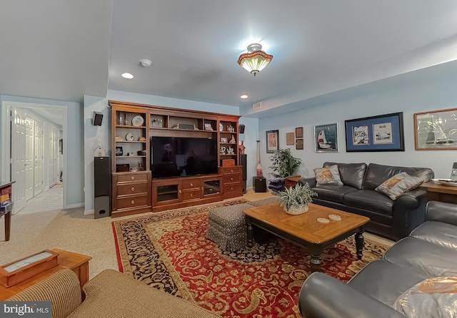 living area featuring carpet flooring, recessed lighting, and visible vents