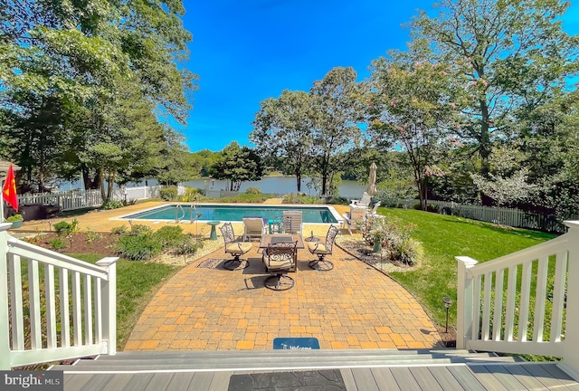 view of swimming pool with a patio area, a fenced backyard, a fenced in pool, and a yard