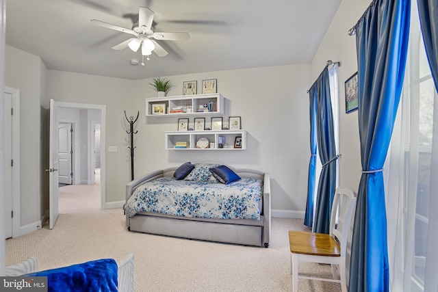 bedroom with baseboards, carpet, and a ceiling fan