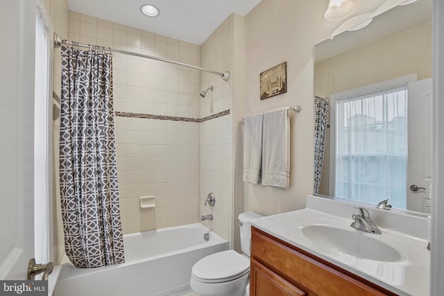 full bathroom with vanity, toilet, and shower / bath combo