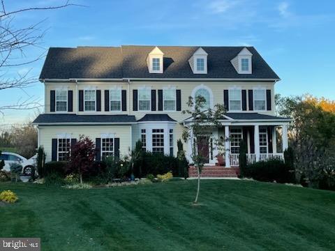 view of front facade with a porch and a front yard