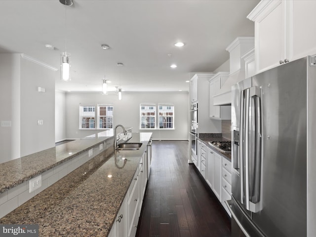 kitchen featuring recessed lighting, appliances with stainless steel finishes, dark wood-type flooring, white cabinets, and a sink