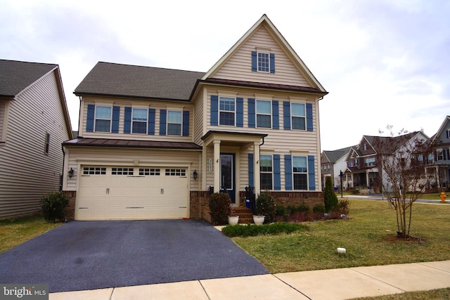 view of front facade with a front lawn, brick siding, a garage, and driveway