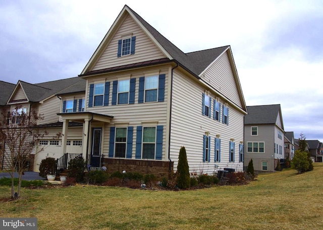 view of front facade with central AC and a front yard