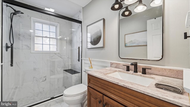 bathroom with toilet, marble finish floor, and a marble finish shower