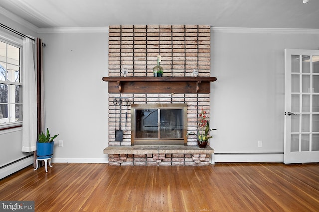 unfurnished living room with ornamental molding, a baseboard radiator, wood finished floors, and a brick fireplace