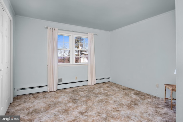 unfurnished room with carpet floors and crown molding