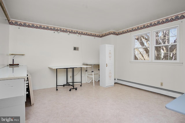 office with a baseboard heating unit, visible vents, and light floors