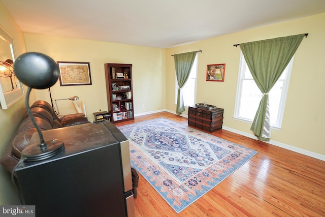 office area with baseboards and hardwood / wood-style flooring