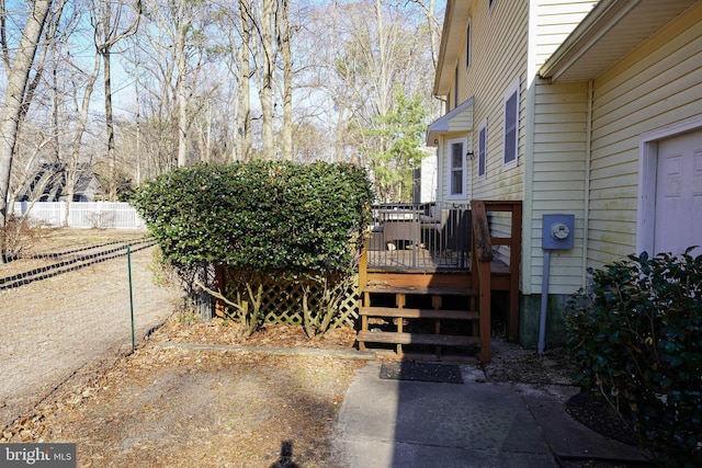 exterior space featuring fence and a wooden deck