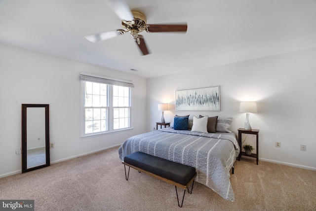 bedroom featuring visible vents, baseboards, carpet floors, and ceiling fan