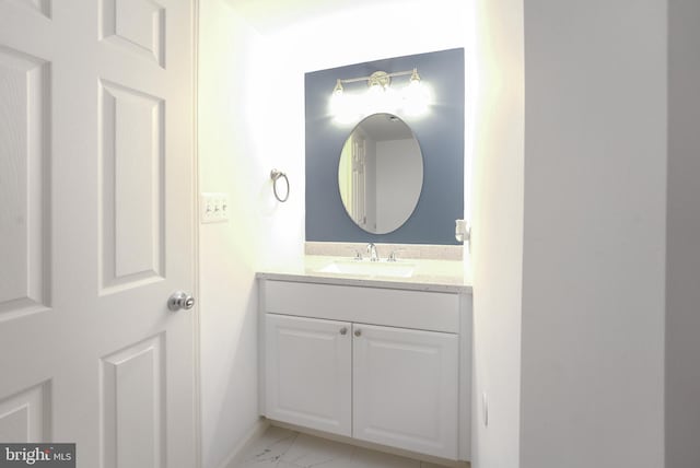 bathroom featuring vanity and marble finish floor