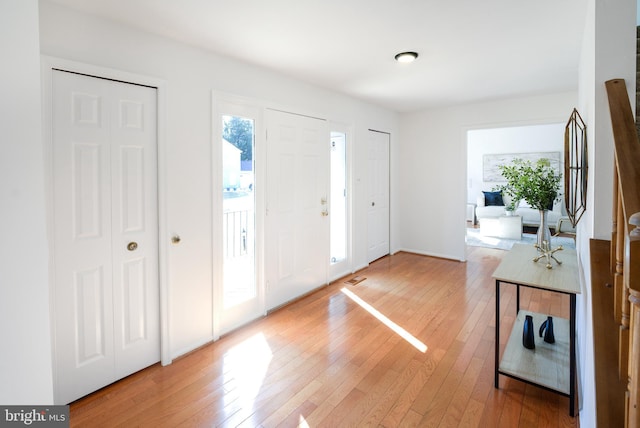 foyer with light wood-style flooring