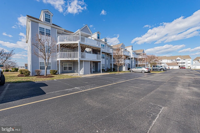 view of property featuring uncovered parking