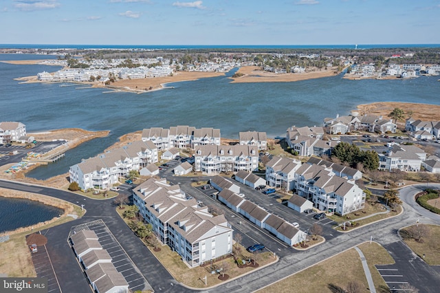 birds eye view of property with a residential view and a water view