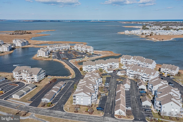 bird's eye view featuring a residential view and a water view