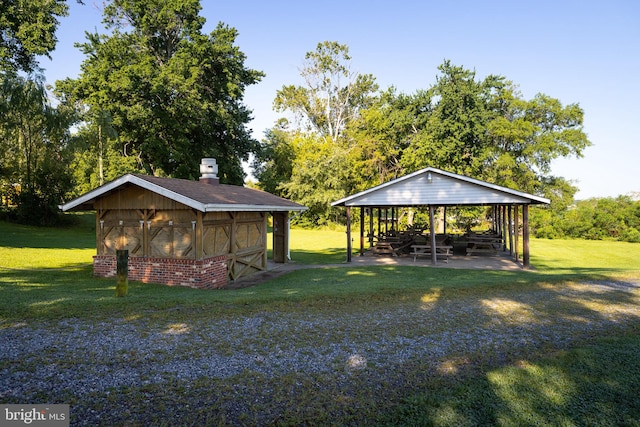 exterior space with a lawn and an outbuilding