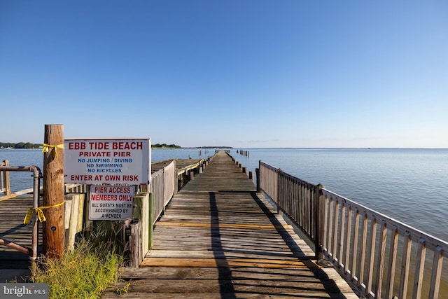 view of dock with a water view