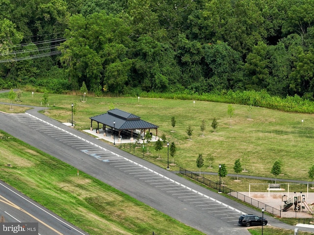 view of property's community featuring a lawn and a gazebo