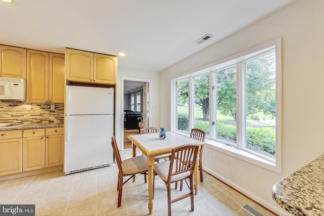 dining space featuring recessed lighting, visible vents, baseboards, and light tile patterned floors